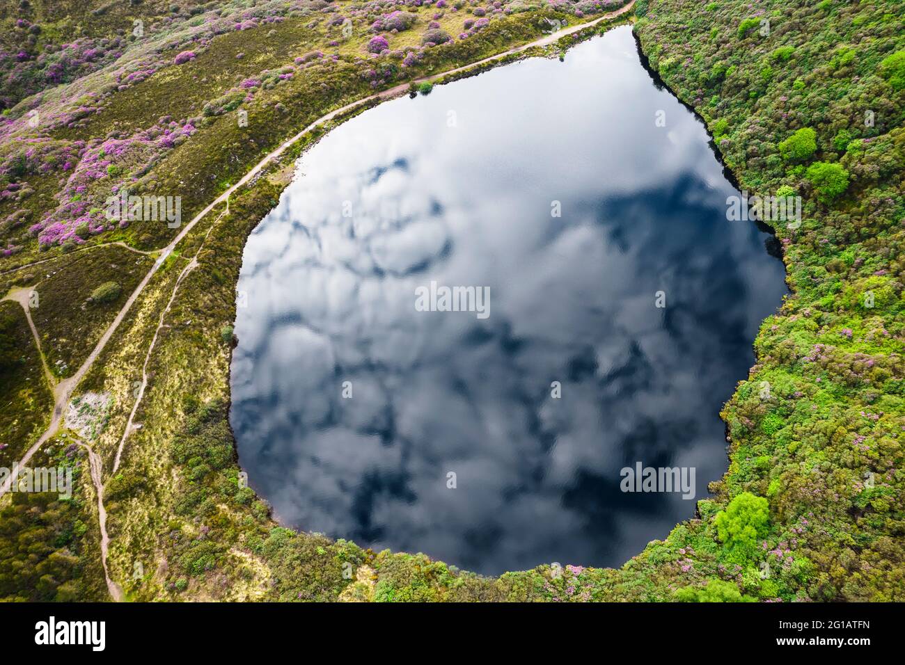 Bay Lough lake in Clogheen, county Tipperary in Ireland. The lake sits on a slope in the midst of the Knockmealdown mountains, looks like a mirror due Stock Photo