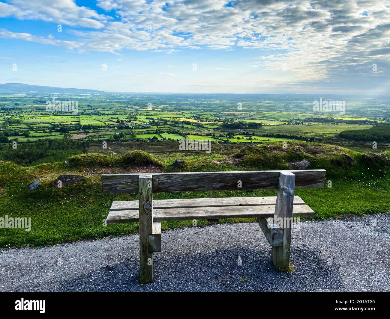 An empty bench near the edge of the road at Vee Pass, a v-shaped turn ...