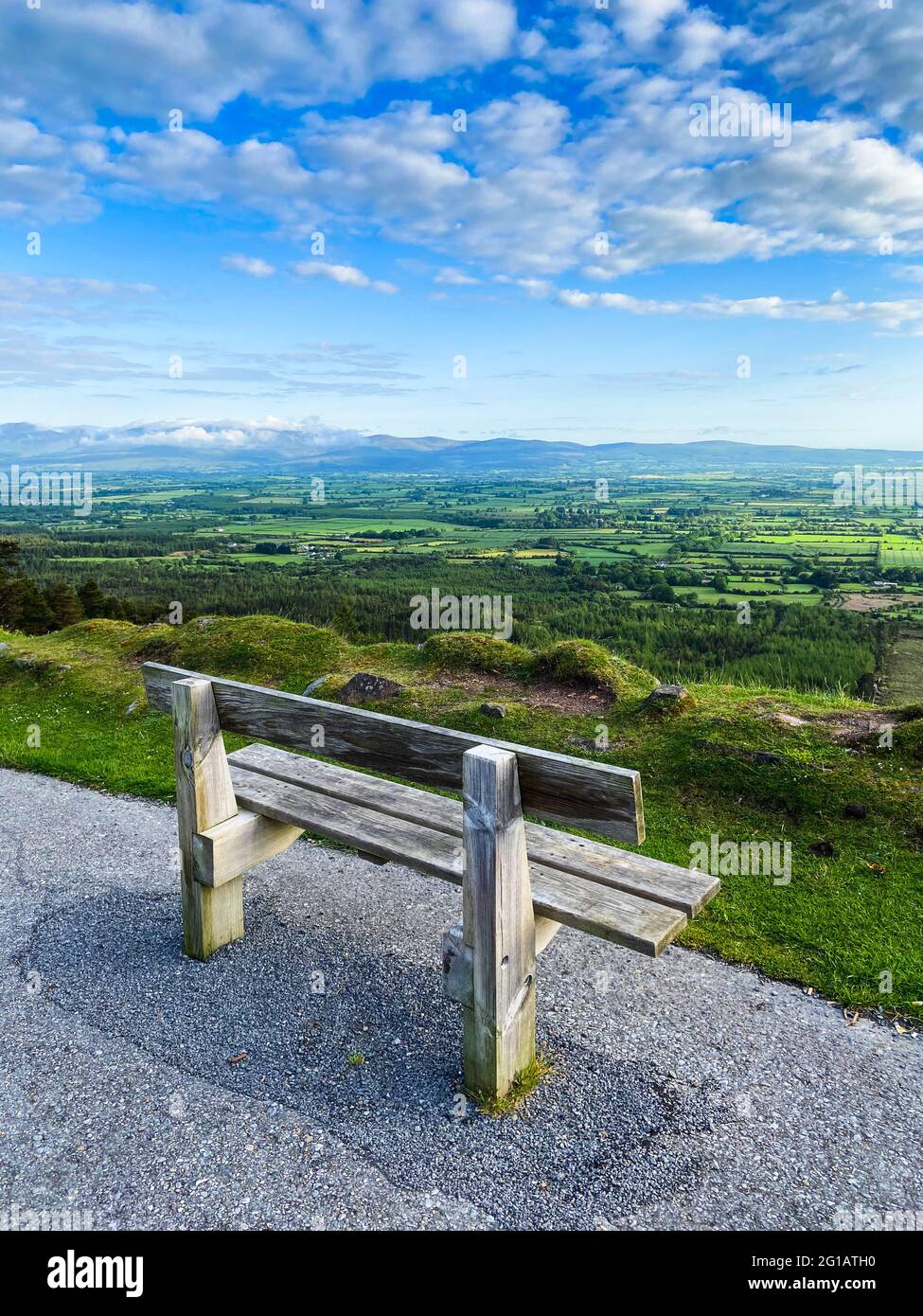 An empty bench near the edge of the road at Vee Pass, a v-shaped turn ...