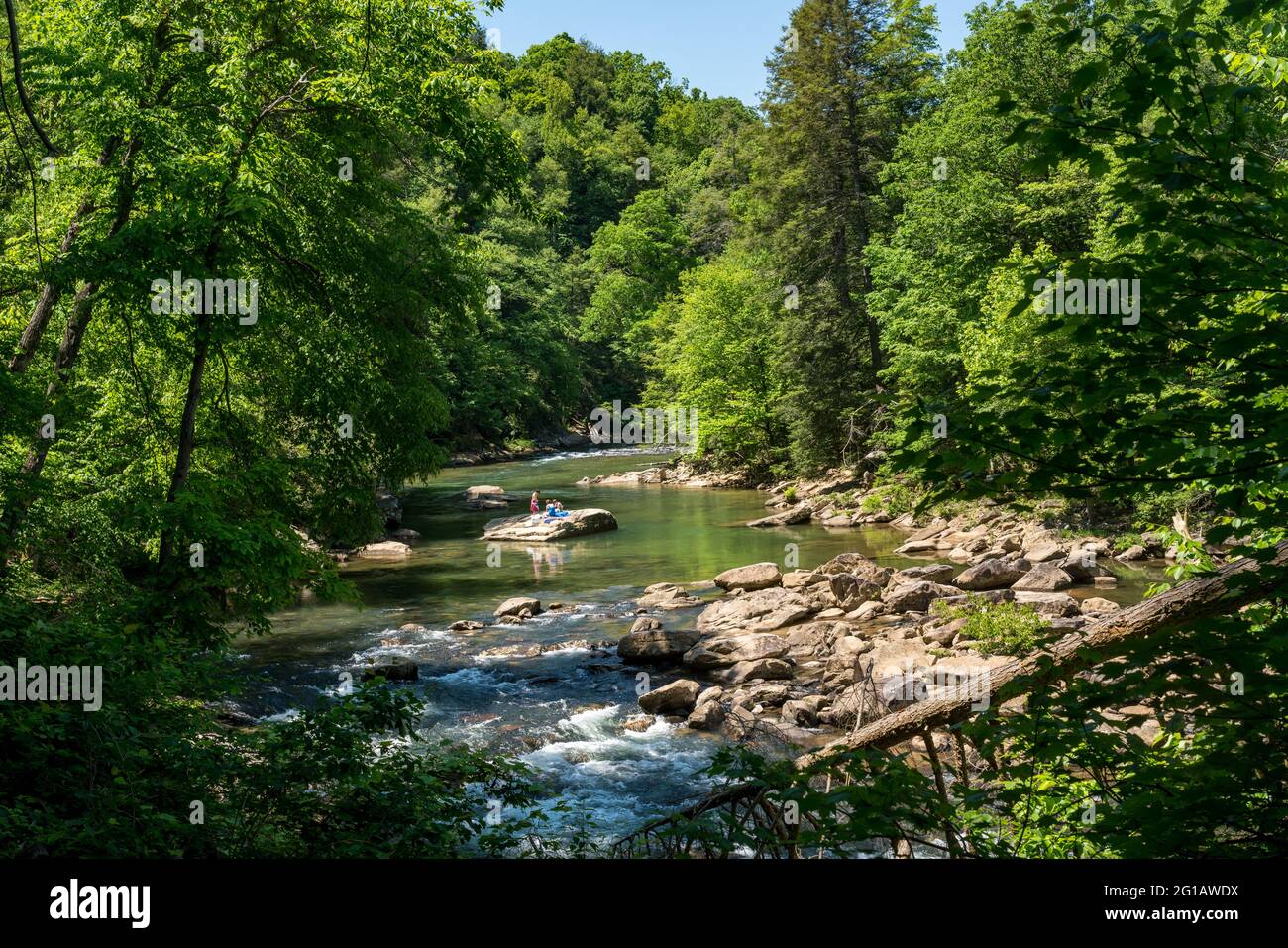 Visitors and families swim in the river at the Audra State Park near
