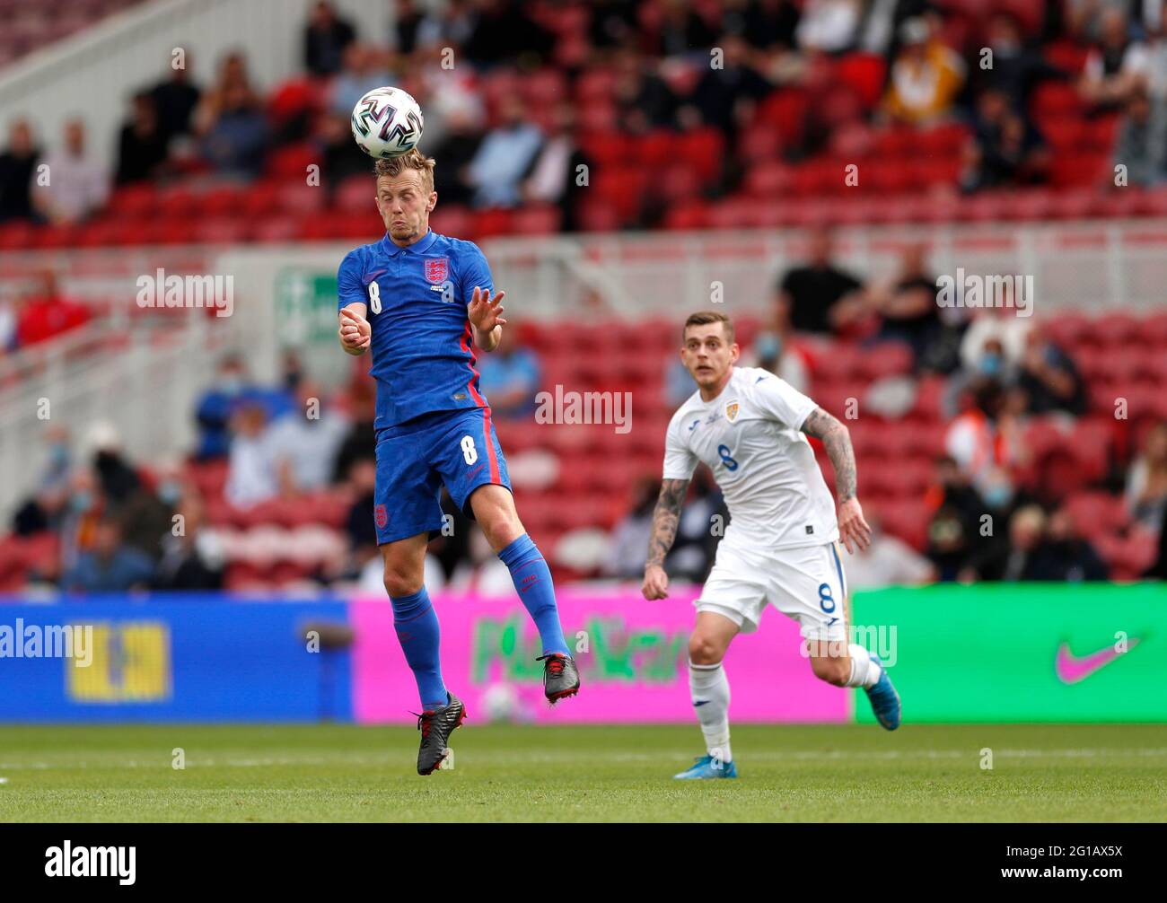 England's James Ward-Prowse and Romania's Vlad Chiriches during the international friendly match at Riverside Stadium, Middlesbrough. Picture date: Sunday June 6, 2021. Stock Photo