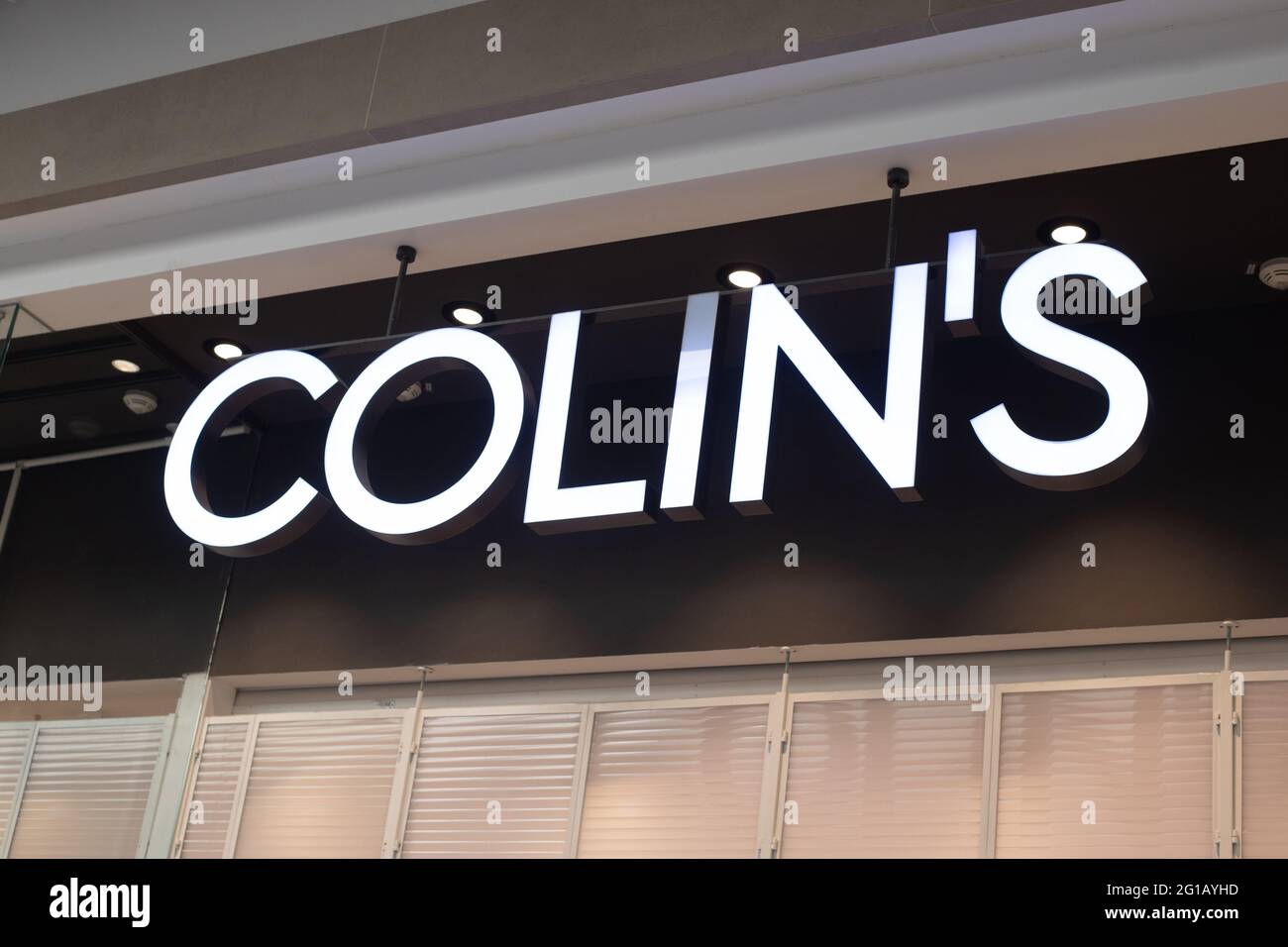 Brand name Colins of white letters on fashion store facade Stock Photo