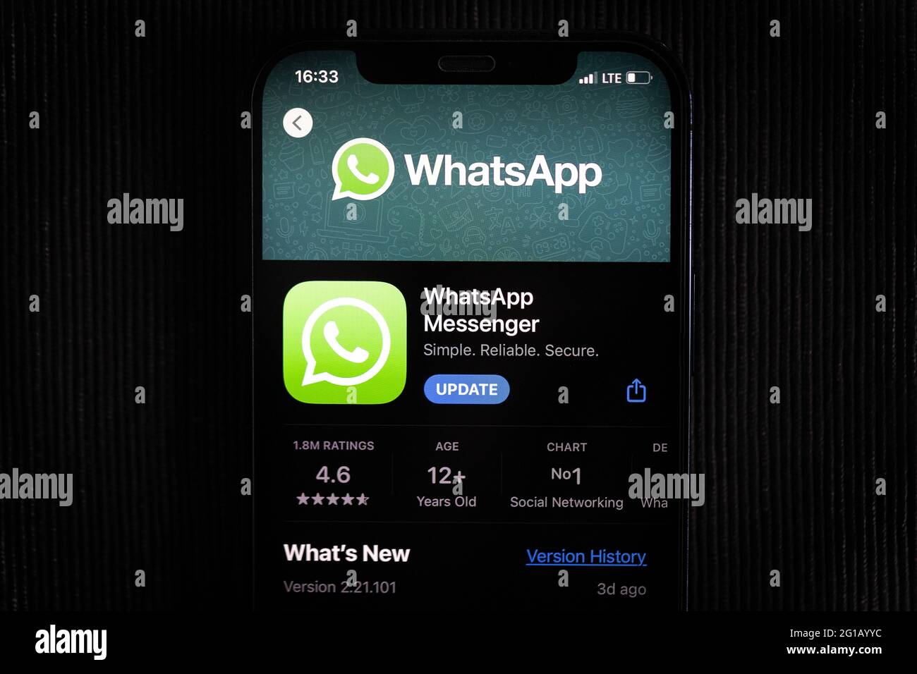 WhatsApp app in the apple App Store seen on an iPhone 12 screen. Stock Photo