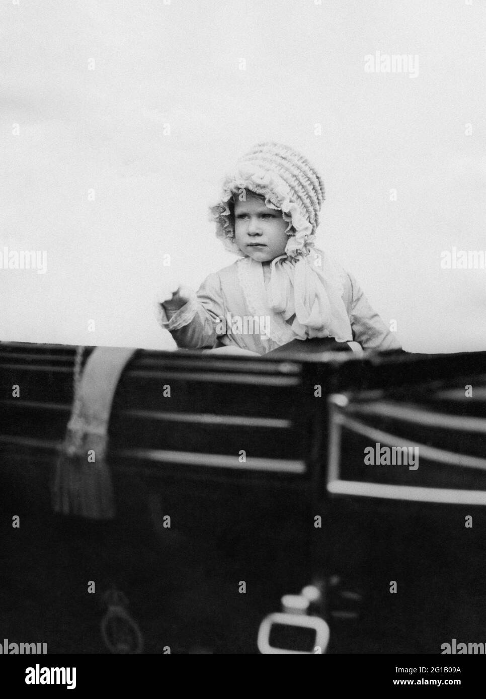 File photo dated 03/05/1928 of Princess Elizabeth - daughter of the Duke and Duchess of York (later King and Queen of England) - waving from the carriage as she drives in London in 1928. The Duchess of Sussex gave birth to a 7lb 11oz daughter, Lilibet 'Lili' Diana Mountbatten-Windsor, on Friday in California and both mother and child are healthy and well, Meghan's press secretary said. Issue date: Sunday June 6, 2021. Stock Photo