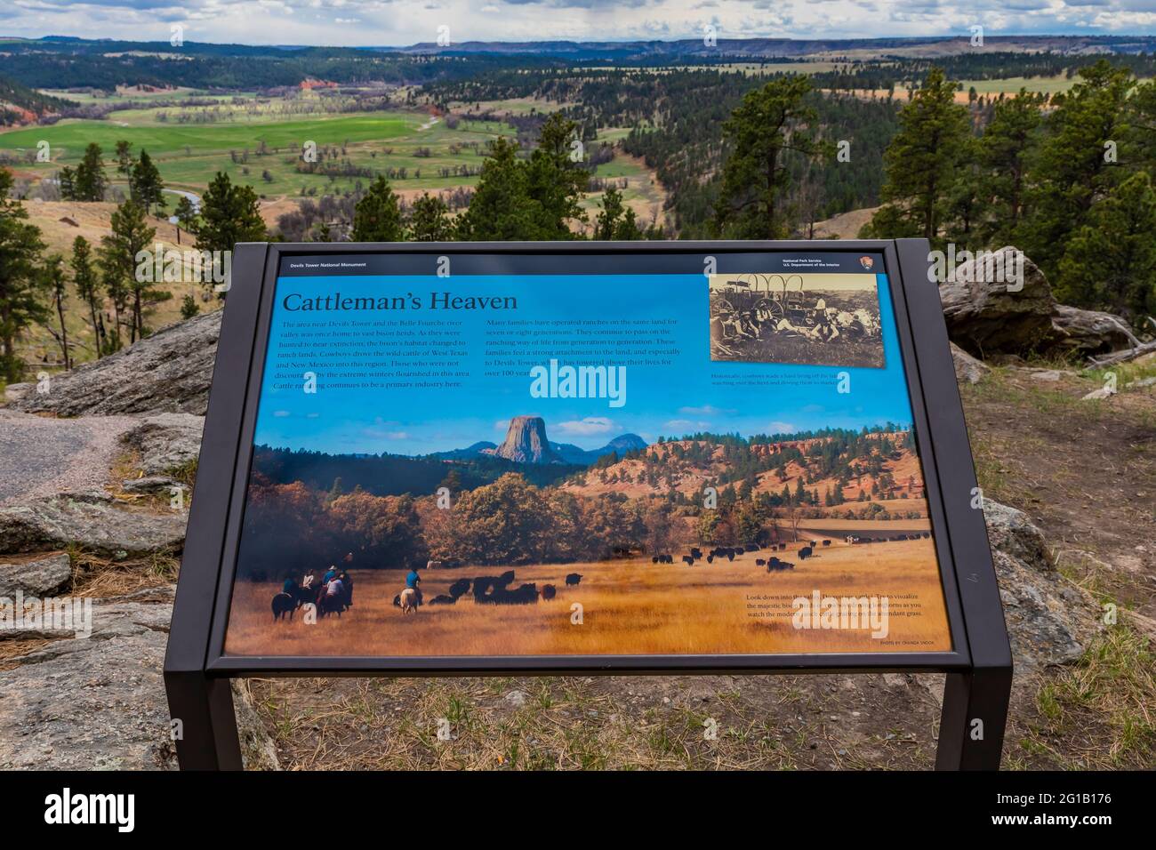 Interpretive sign about cattle ranching near Devils Tower, along Tower Trail in Devils Tower National Monument, Wyoming, USA {No artist release; avail Stock Photo