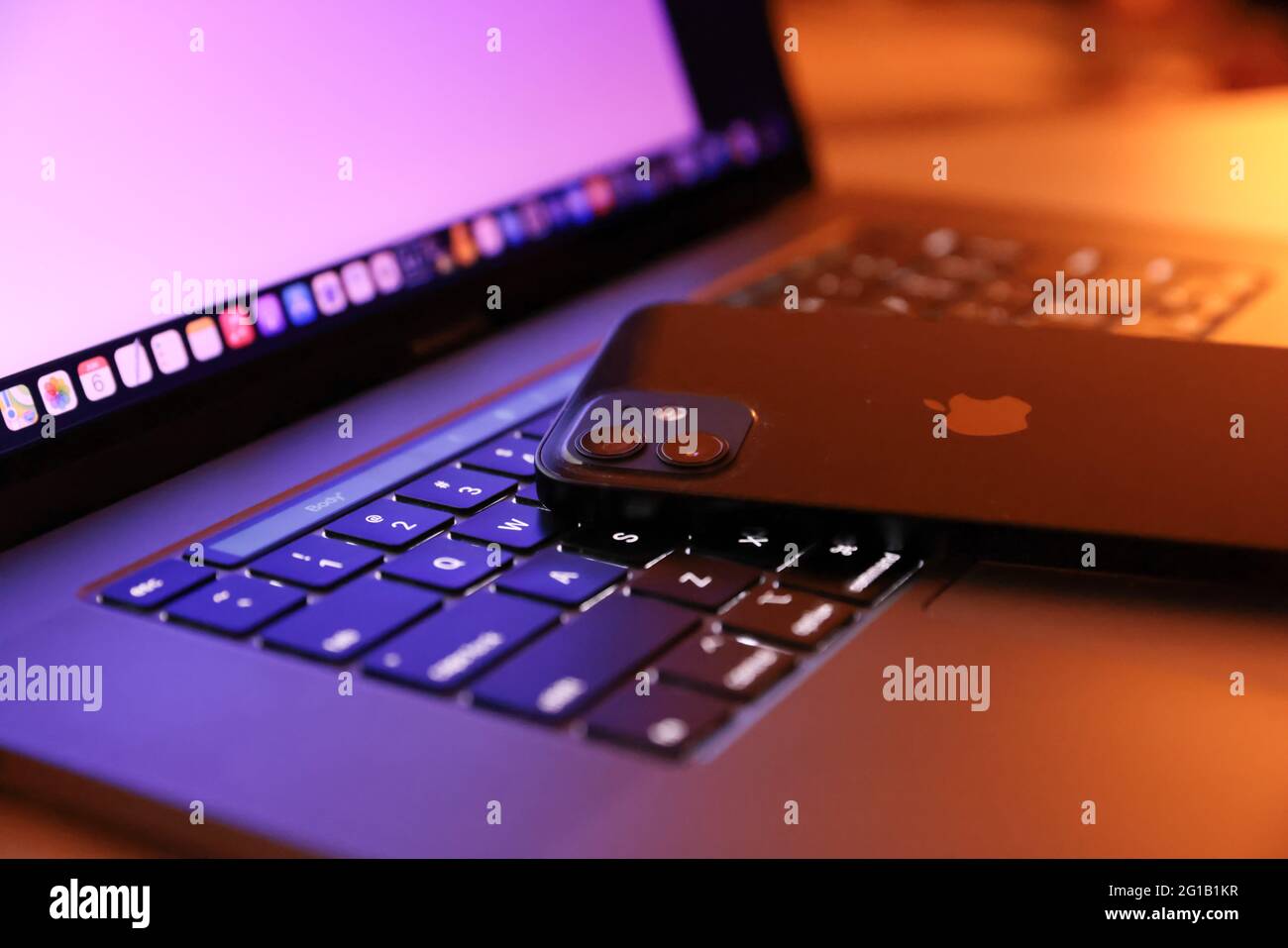 Tokyo, Japan. 06th June, 2021. In this photo illustration, Apple's iPhone 12 seen placed on a MacBook Pro. Credit: SOPA Images Limited/Alamy Live News Stock Photo