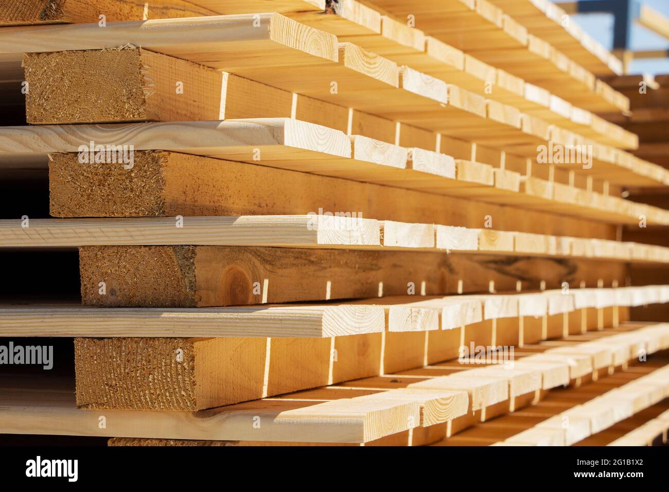 Wooden planks. Stack of wood for air drying. Air drying of wood Stock