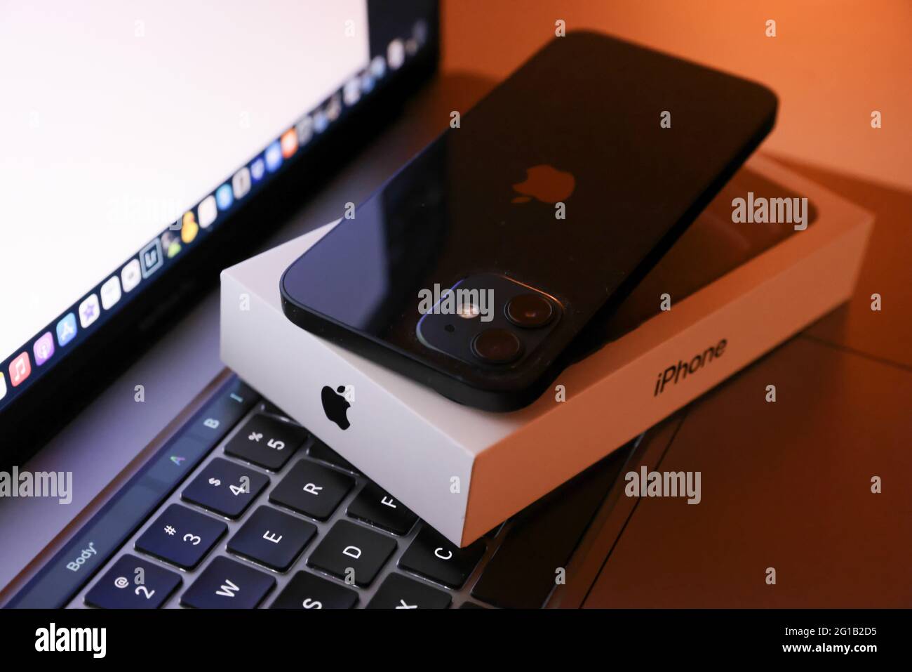 Tokyo, Japan. 06th June, 2021. In this photo illustration, Apple's iPhone 12 seen placed on a MacBook Pro. (Photo by Stanislav Kogiku/SOPA Images/Sipa USA) Credit: Sipa USA/Alamy Live News Stock Photo