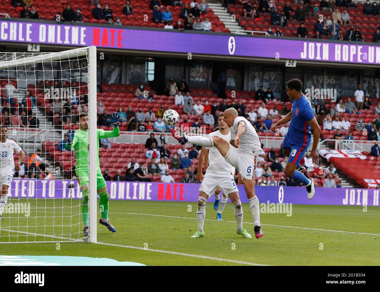 Middlesbrough, England, 6th June 2021. Vlad Chiriches of Romania diverts a header from Jude Bellingham of England over the bar during the International Friendly match at the Riverside Stadium, Middlesbrough. Picture credit should read: Darren Staples / Sportimage Stock Photo
