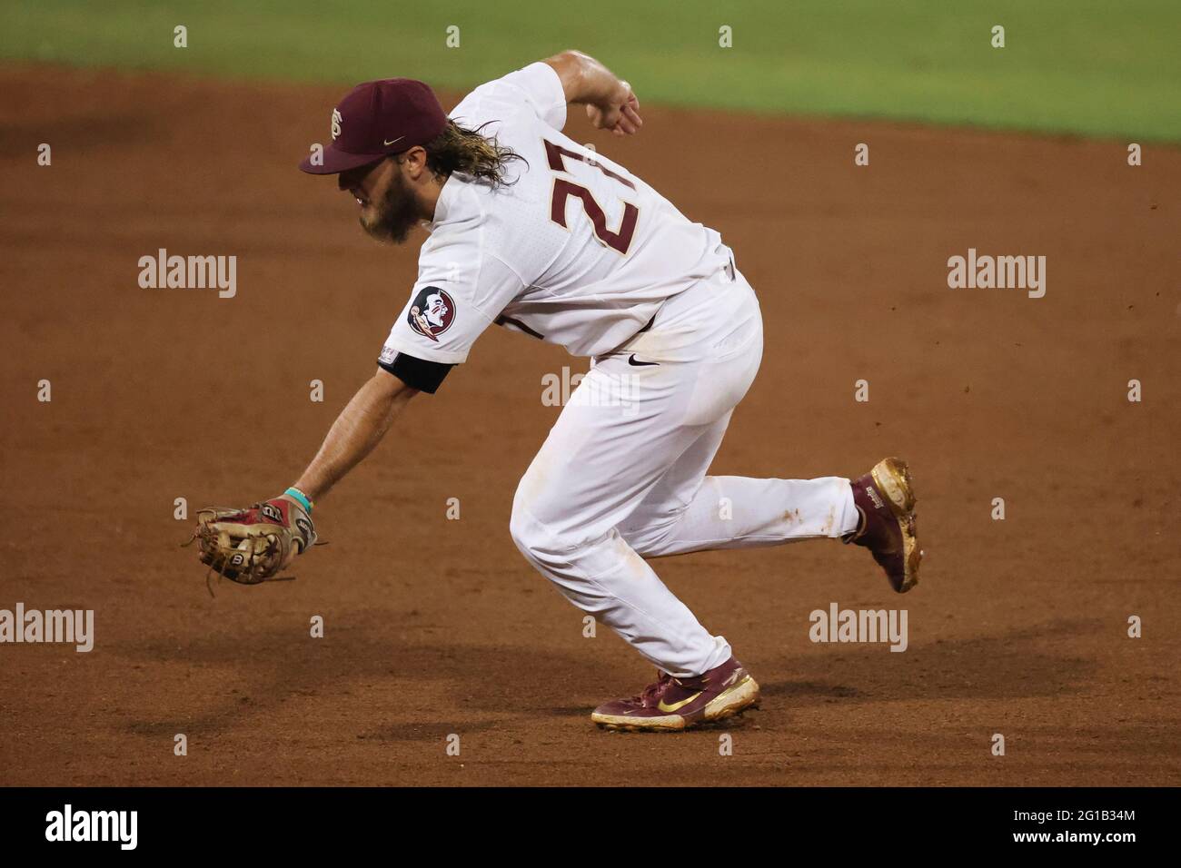 June 05, 2021: Florida State infielder Jackson Greene (27) snags a ...