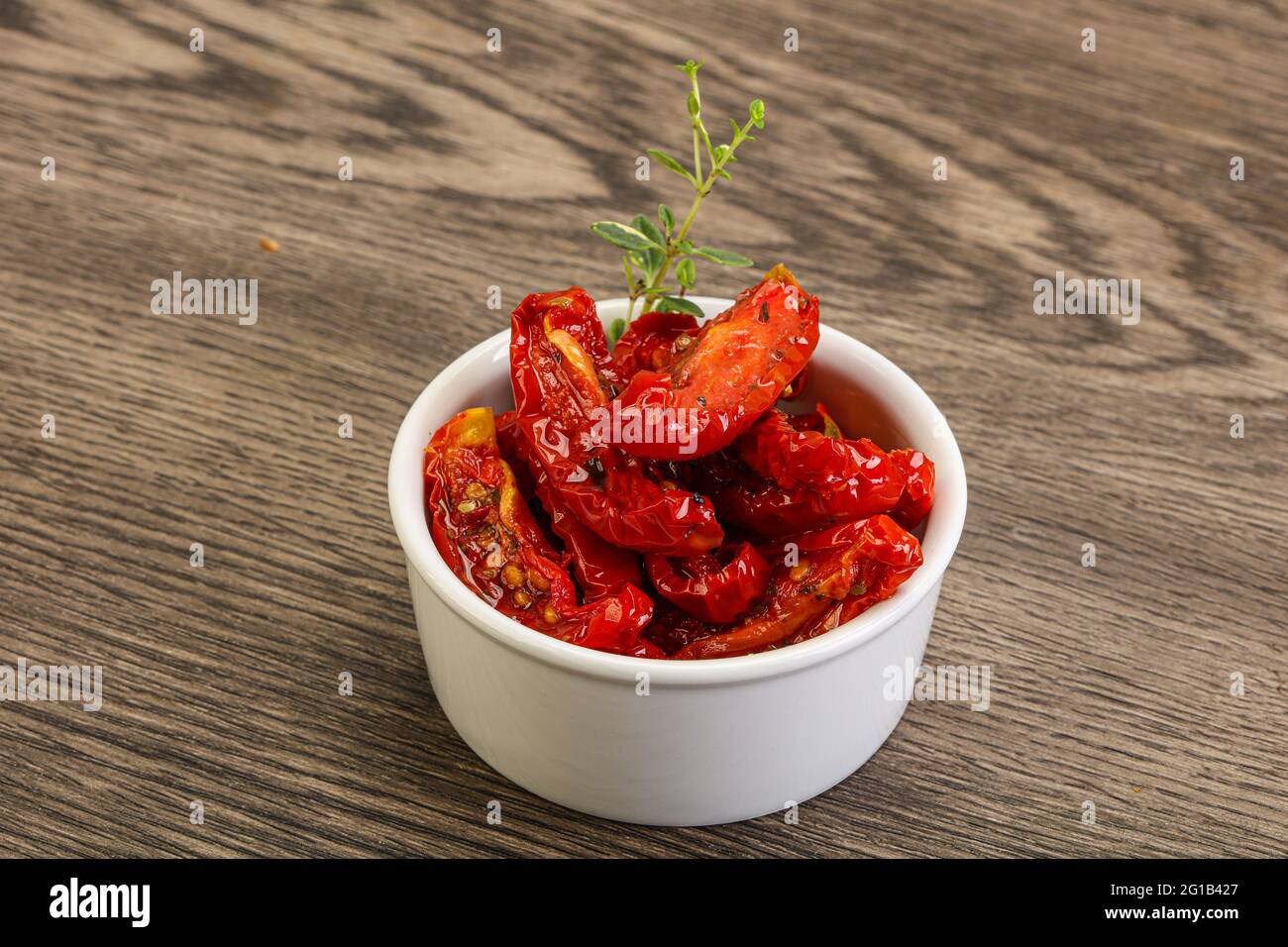 Sundried tomato in olive oil with herbs and spices Stock Photo Alamy