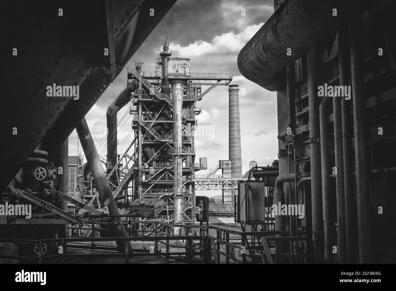 Industrial culture in the landscape park Duisburg Nord. Steel work in the Ruhr area with a large steel framework in surreal monochrome black and white. Stock Photo