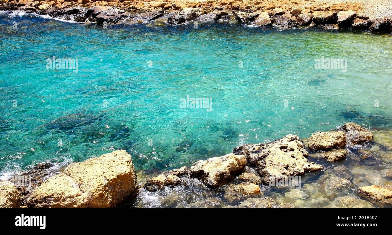 Clear emerald water in a small lagoon in Protaras on the island of ...