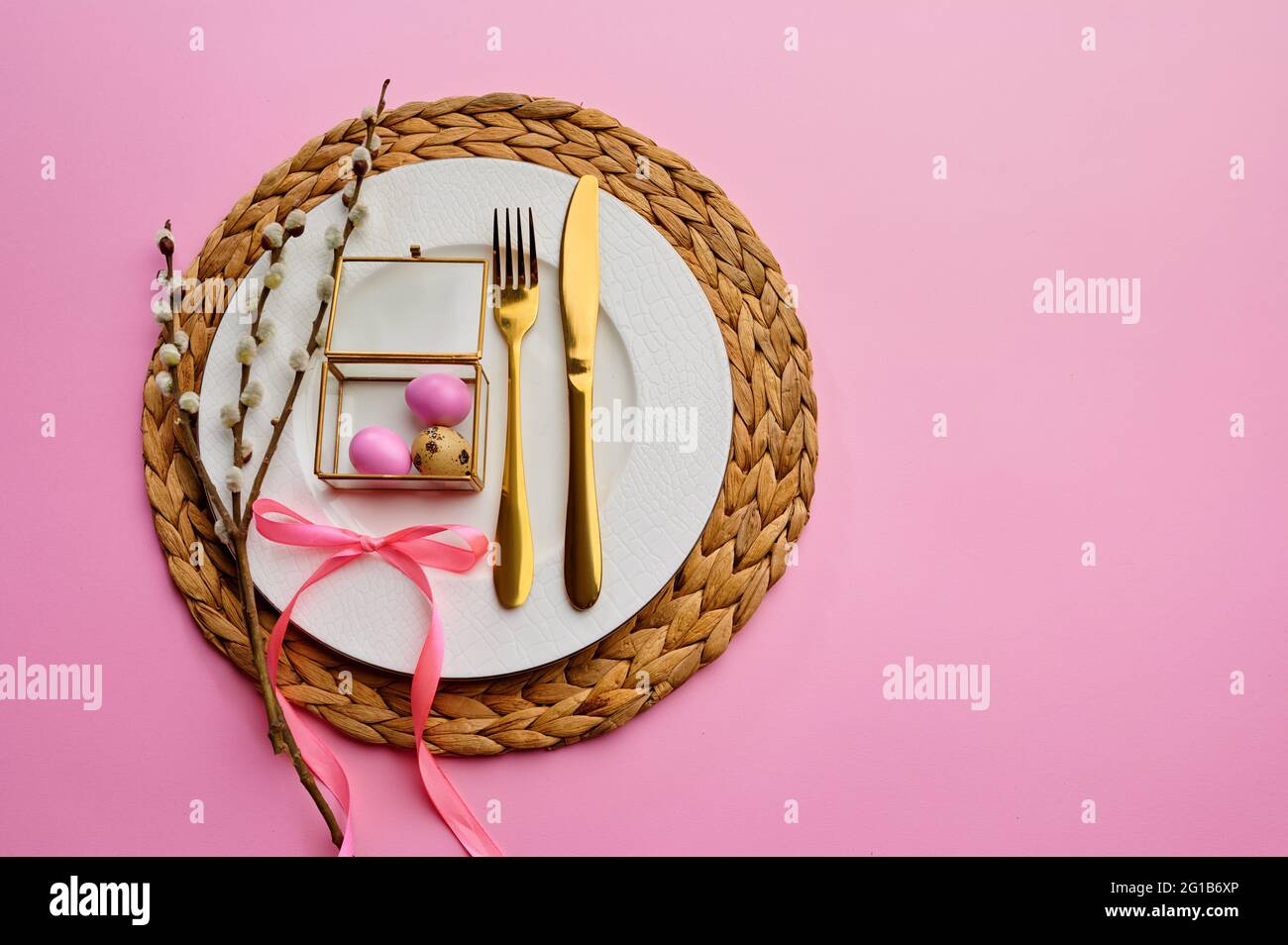 Blooming willow, easter egg on plate and tableware Stock Photo