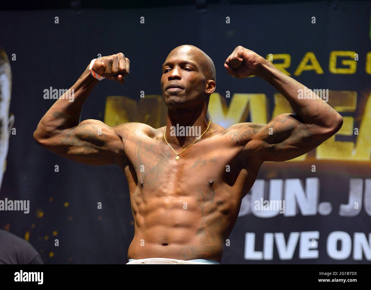 Chad Johnson poses for photographers during a weigh-in Saturday