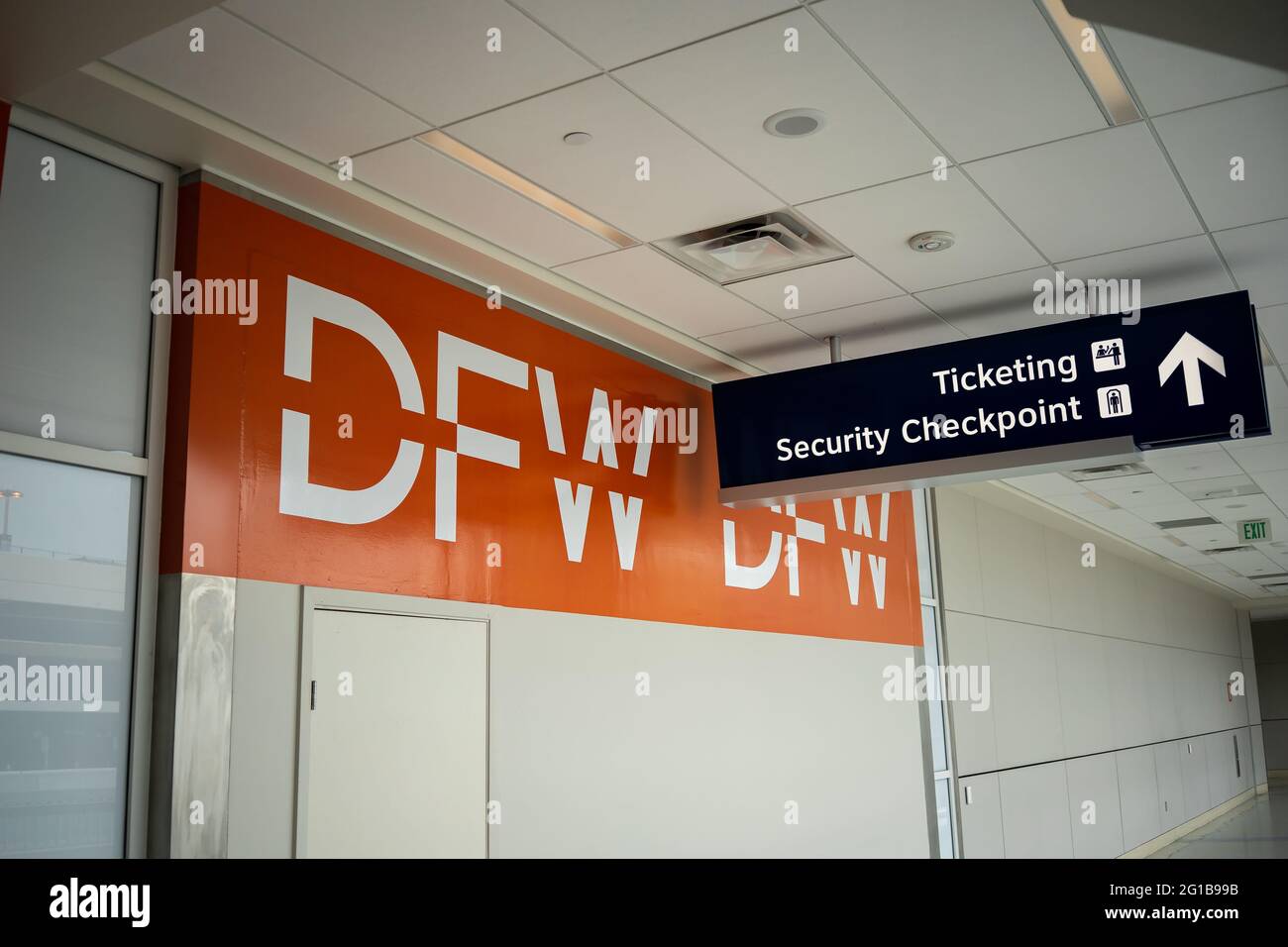 Sign with huge letters at DFW International Airport in Dallas, Texas displaying direction of the security checkpoint and ticketing on terminal A Stock Photo