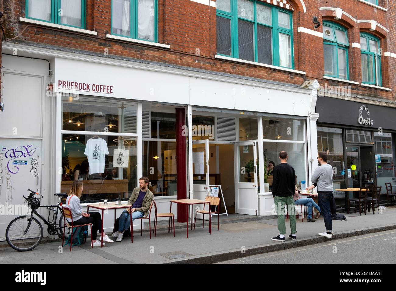 People customers social distancing sitting tables outside Prufrock Coffee  shop during Covid pandemic in Exmouth Market London England UK KATHY DEWITT  Stock Photo - Alamy