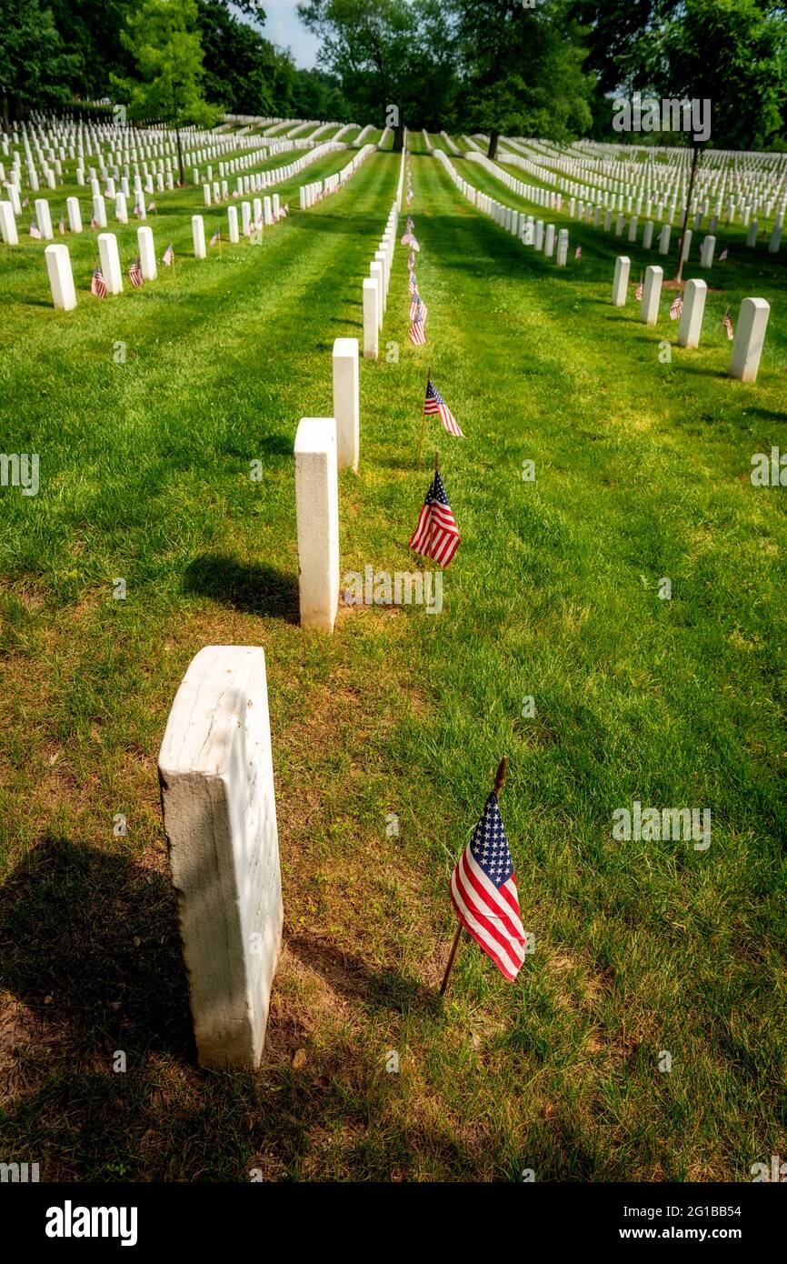 Flags at aver grave marker at Arlington cemetery Stock Photo - Alamy