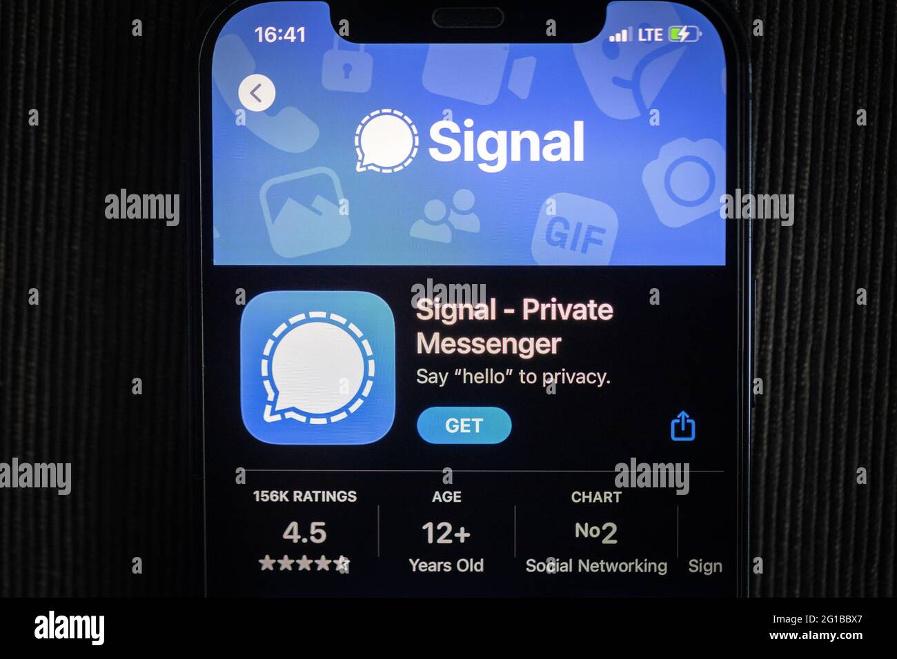 Signal app in the apple App Store seen on an iPhone 12 screen Stock