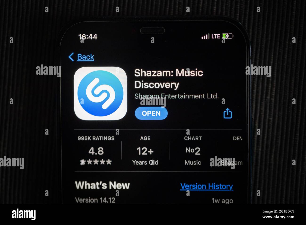 Shazam app in the apple App Store seen on an iPhone 12 screen. Stock Photo
