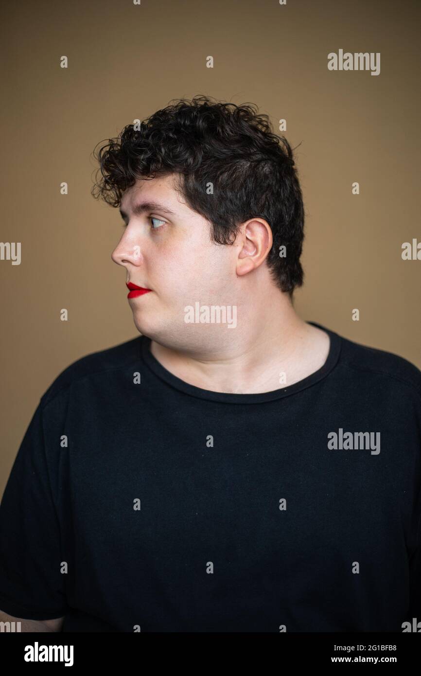 Feminine overweight male with red lips representing concept of ...