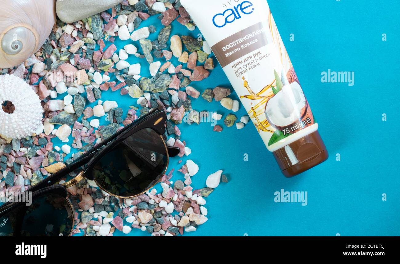 Abstract background with sunglasses and seashells.  Corner frame with copy space for text. Top view, flat lay. Stock Photo