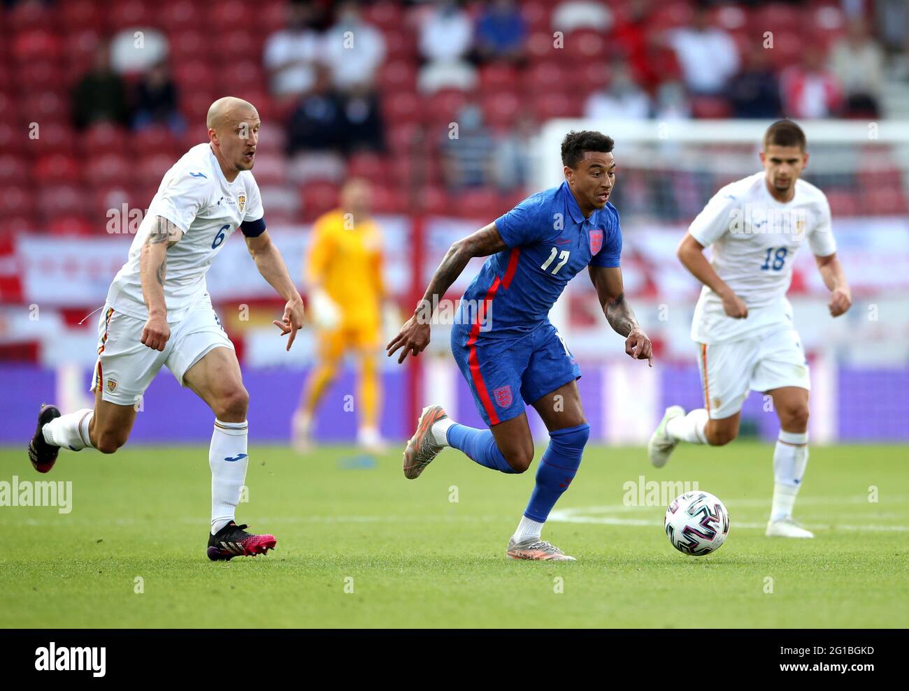 England's Jesse Lingard (centre) battles for the ball with Romania's Vlad Chiriches (left) and Razvan Marin during the international friendly match at Riverside Stadium, Middlesbrough. Picture date: Sunday June 6, 2021. Stock Photo