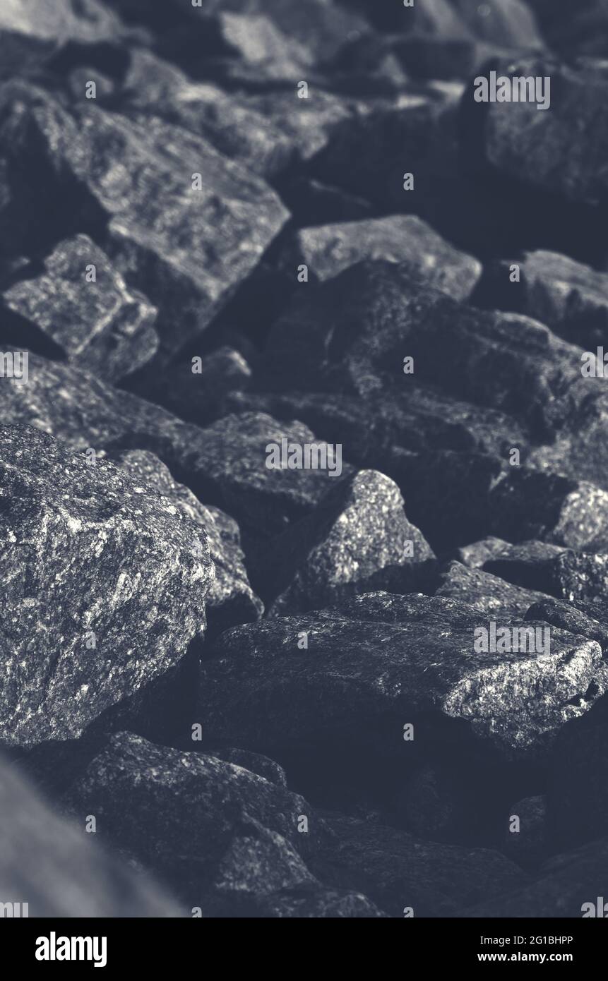 Dark grunge background. Toned mountain texture. Close-up. Monochrome.Background And Copy Space For Text On Theme Geology Stock Photo