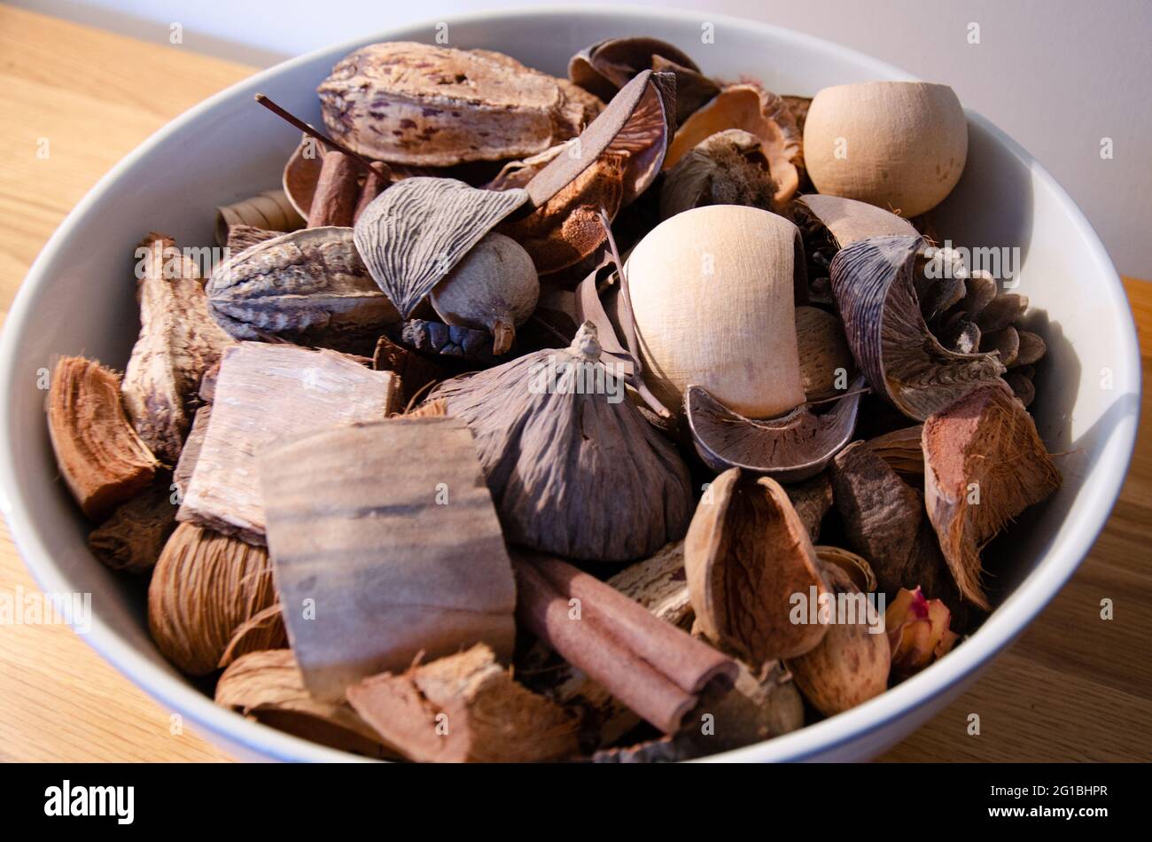 A decorative dish of potpourri with earthy brown tones. Stock Photo