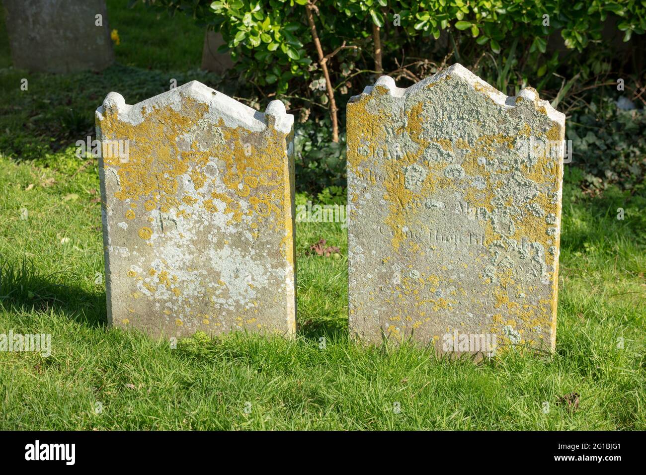 Two weathered tombstones Stock Photo - Alamy
