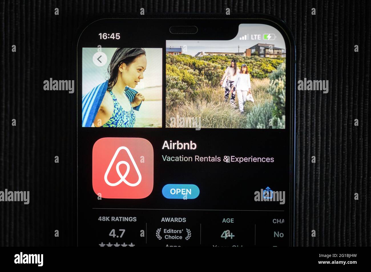Airbnb app in the apple App Store seen on an iPhone 12 screen. Stock Photo