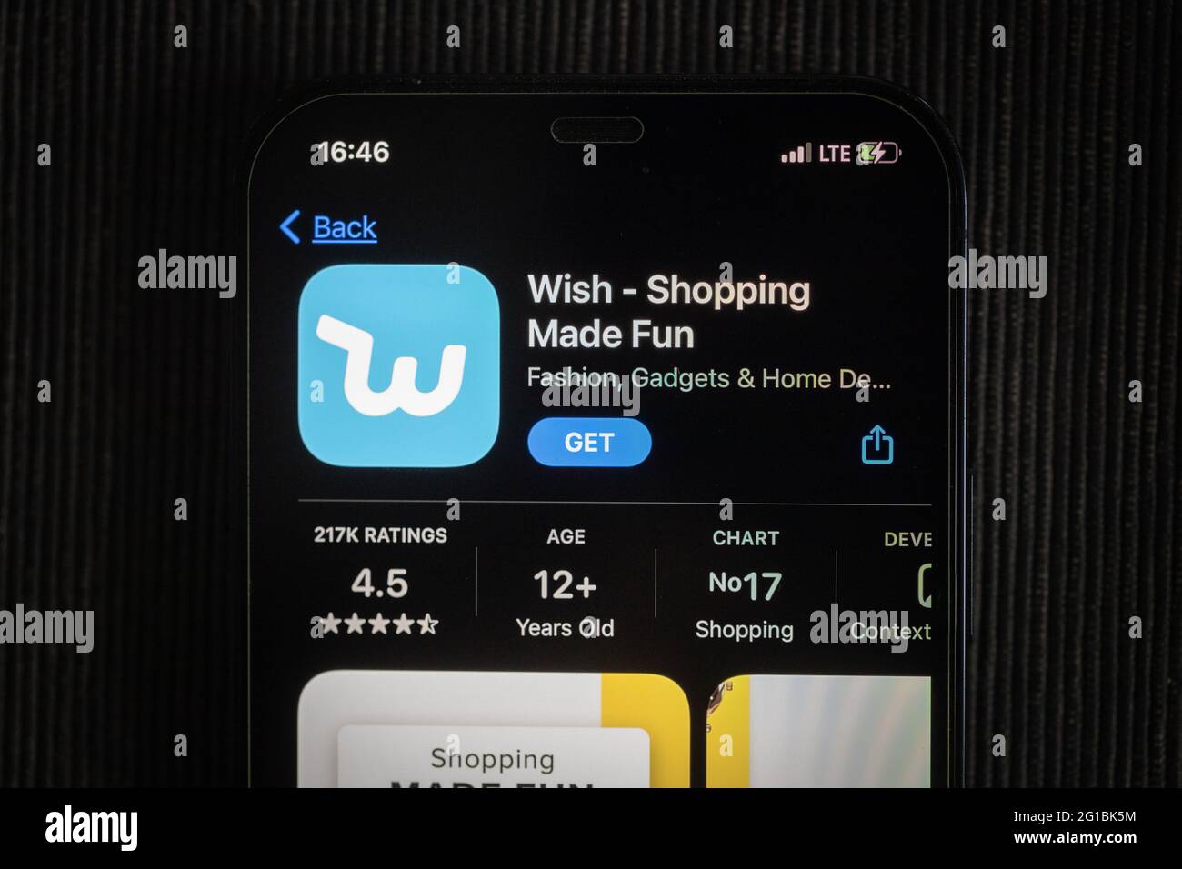 Wish app in the apple App Store seen on an iPhone 12 screen. Stock Photo