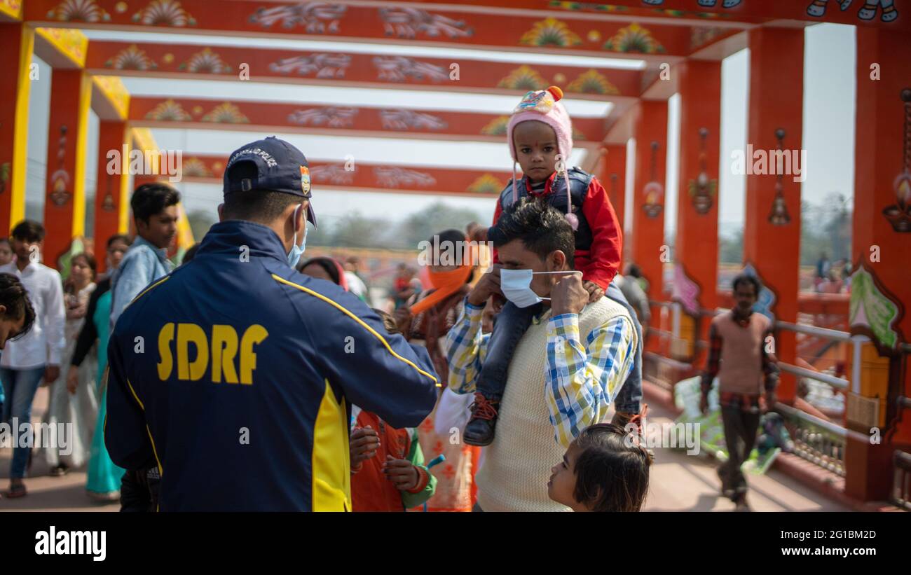 Haridwar, Uttarakhand India April 06, 2021. Policemen spreading awareness of protection from Coronavirus to stay safe from Coronavirus during Maha Kumbh 2021. Apple prores 422 High-quality 4k footage. Stock Photo