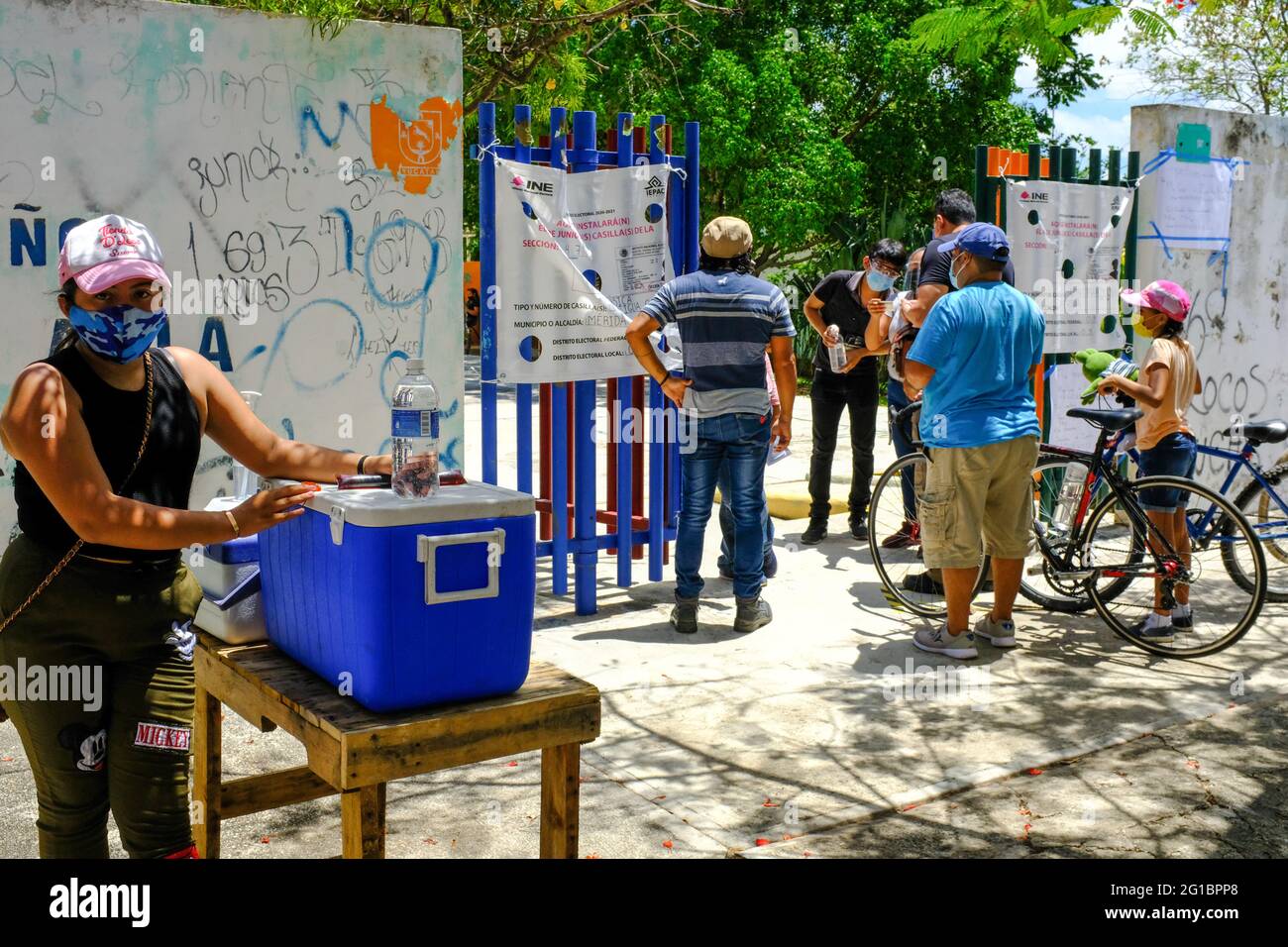 June 6, 2021 : In the midst of the Covid-19 pandemic: Millions of Mexicans still turned-out to vote in the midterm elections that will determine the makeup of the Mexican 500-seat Chamber of Deputies, the lower house of Congress, as well as 15 governorships and thousands of positions for mayoral and local councillor jobs. In this picture: A Mexican voter gets ready to enter a polling station in Merida, Yucatan Stock Photo