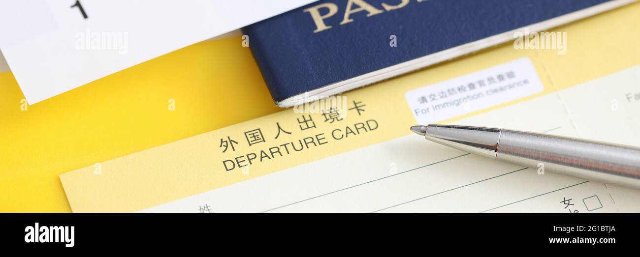 On table is passport, ticket and form for departure Stock Photo