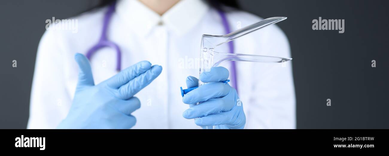 Gynecologist holds an instrument for examining women Stock Photo