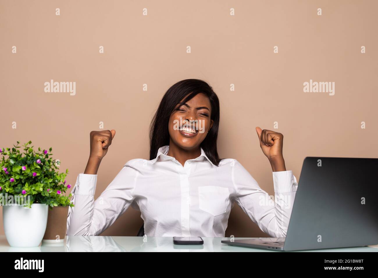 Excited african office businesswoman receiving good news in email on ...