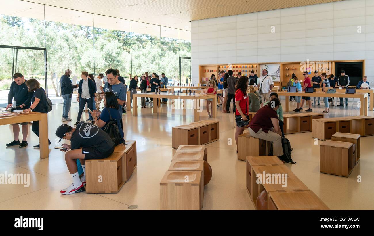 Cupertino, CA, USA - August 2019: Apple Store in Cupertino with people examining Apple products, Apple Headquarters infinite loop Stock Photo