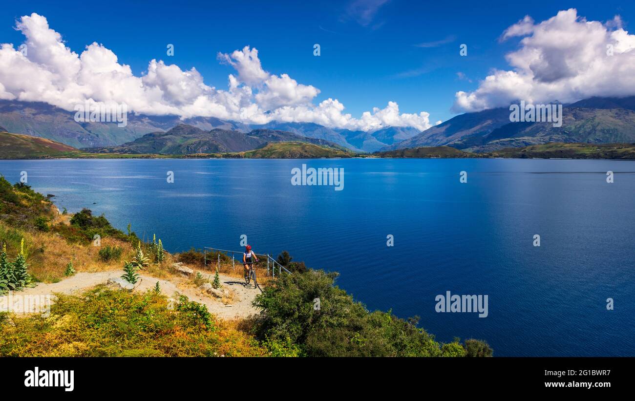 Cycling the shore of Lake Wanaka, Otago, South Island, New Zealand ...