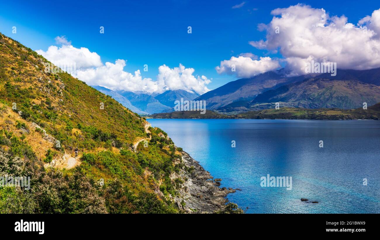 Cycling the shore of Lake Wanaka, Otago, South Island, New Zealand ...