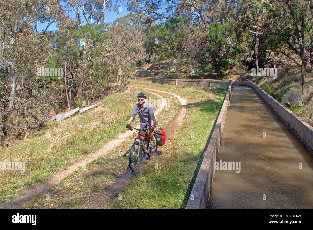 Cyclist on the Goldfields Track beside the Coliban Water Channel near Bendigo Stock Photo