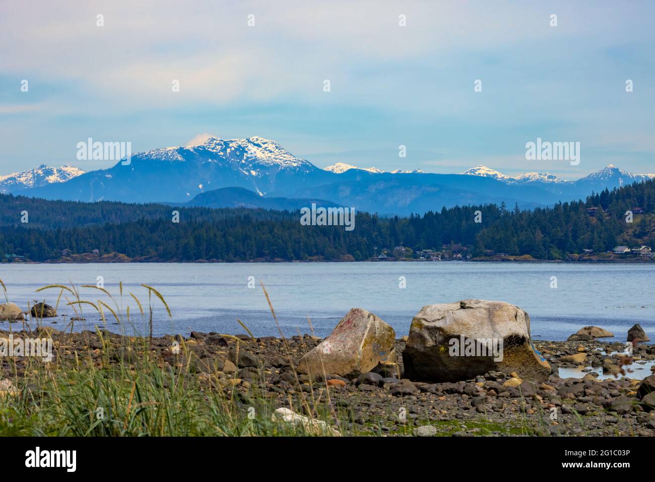 View from Campbell River, on Vancouver Island looking towards the mainland and coastal mountain range, BC, Canada Stock Photo