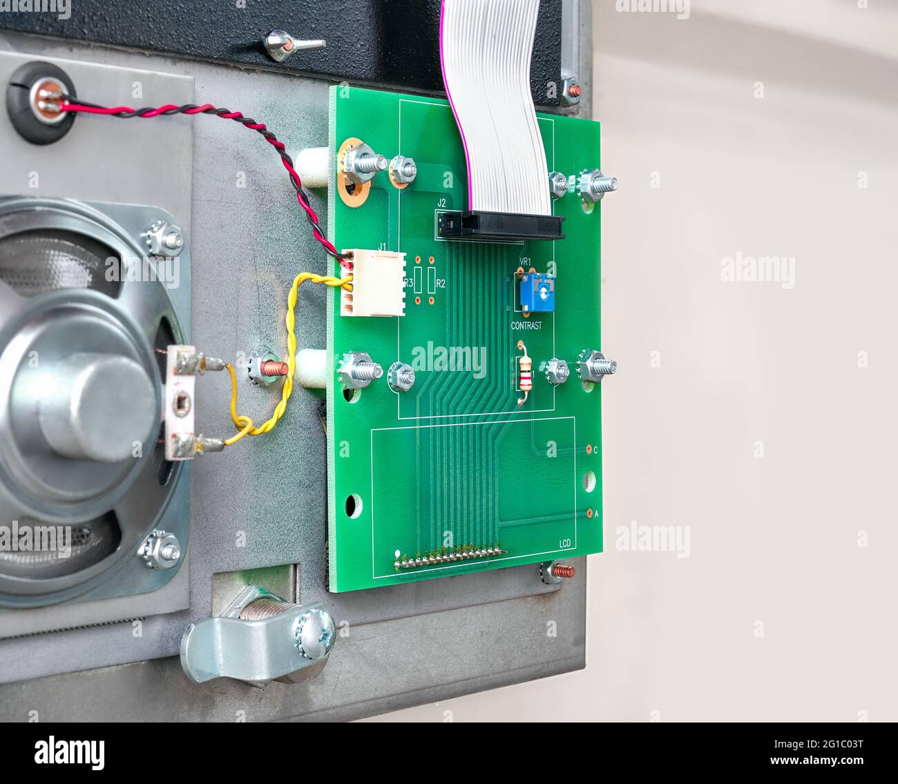 Open intercom cabinet with ribbon cable, lcd interface and speaker. Inside  sideview of autodialer interphone system mounted outside of strata building  Stock Photo - Alamy