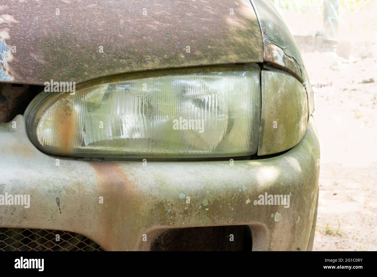 Close-up of an old car headlamp. Selective focus points. Blurred background Stock Photo