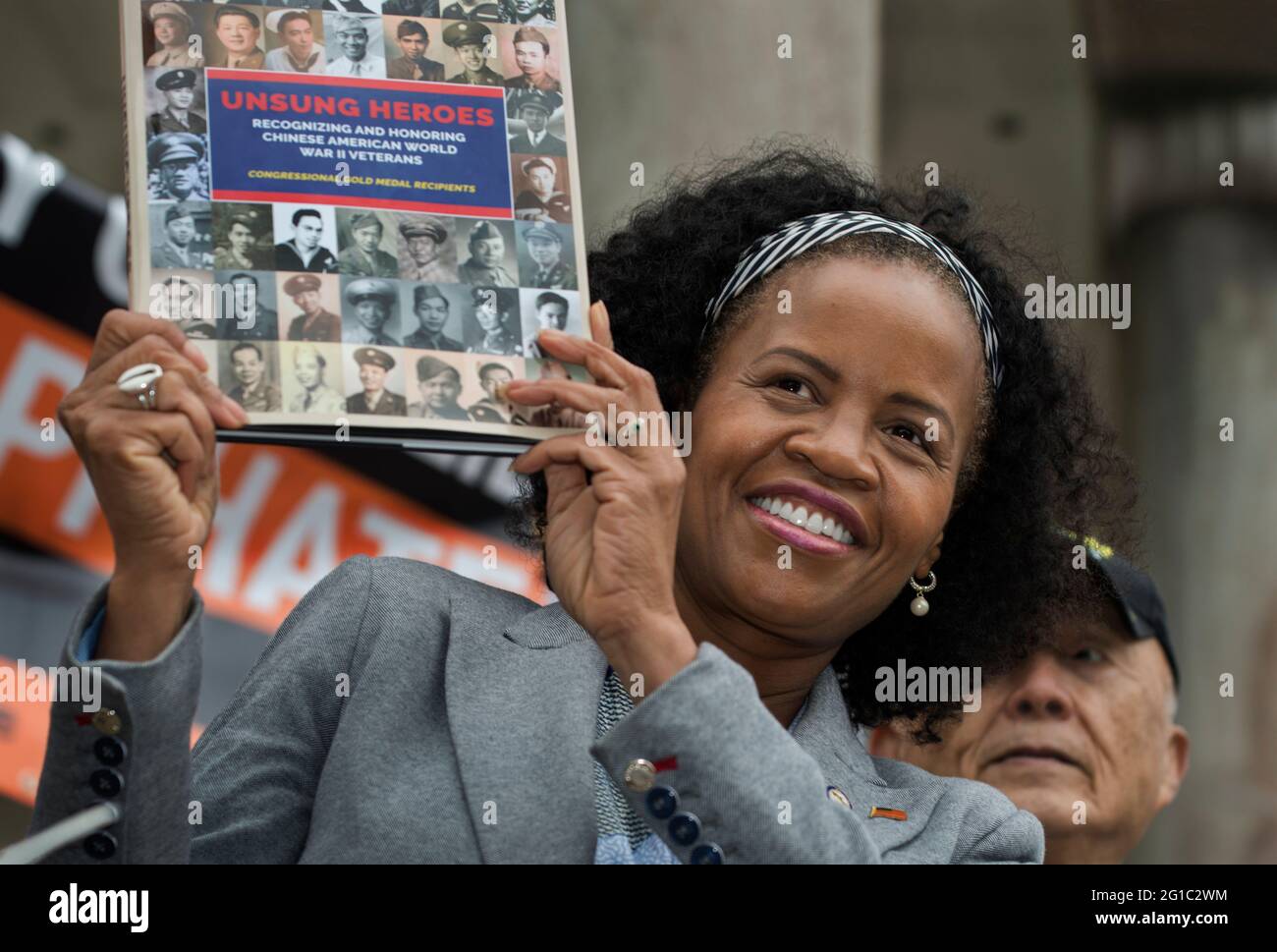 Kim Janey, 56, acting Mayor of Boston, Massachusetts USA. 31 May 2021. Janey is shown holding a copy of the book ‘Recognizing and Honoring Chinese American World War II Veterans-Congressional Gold Medal Recipients’ on Parkman Band Stand in the Boston Common during the National Day of Solidarity Against Asian American and Pacific Islanders (AAPI) Hate. The book was presented to her by retired U.S. Army Major General William Chen. General Chen, the highest ranking Chinese American to serve in the U.S. Army is shown in standing behind Janey. Stock Photo
