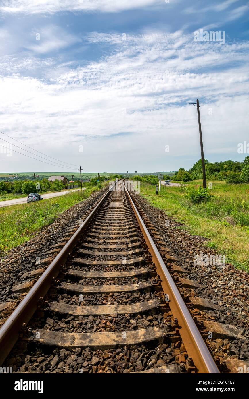 Summer landscape with railroad rails and road Stock Photo - Alamy