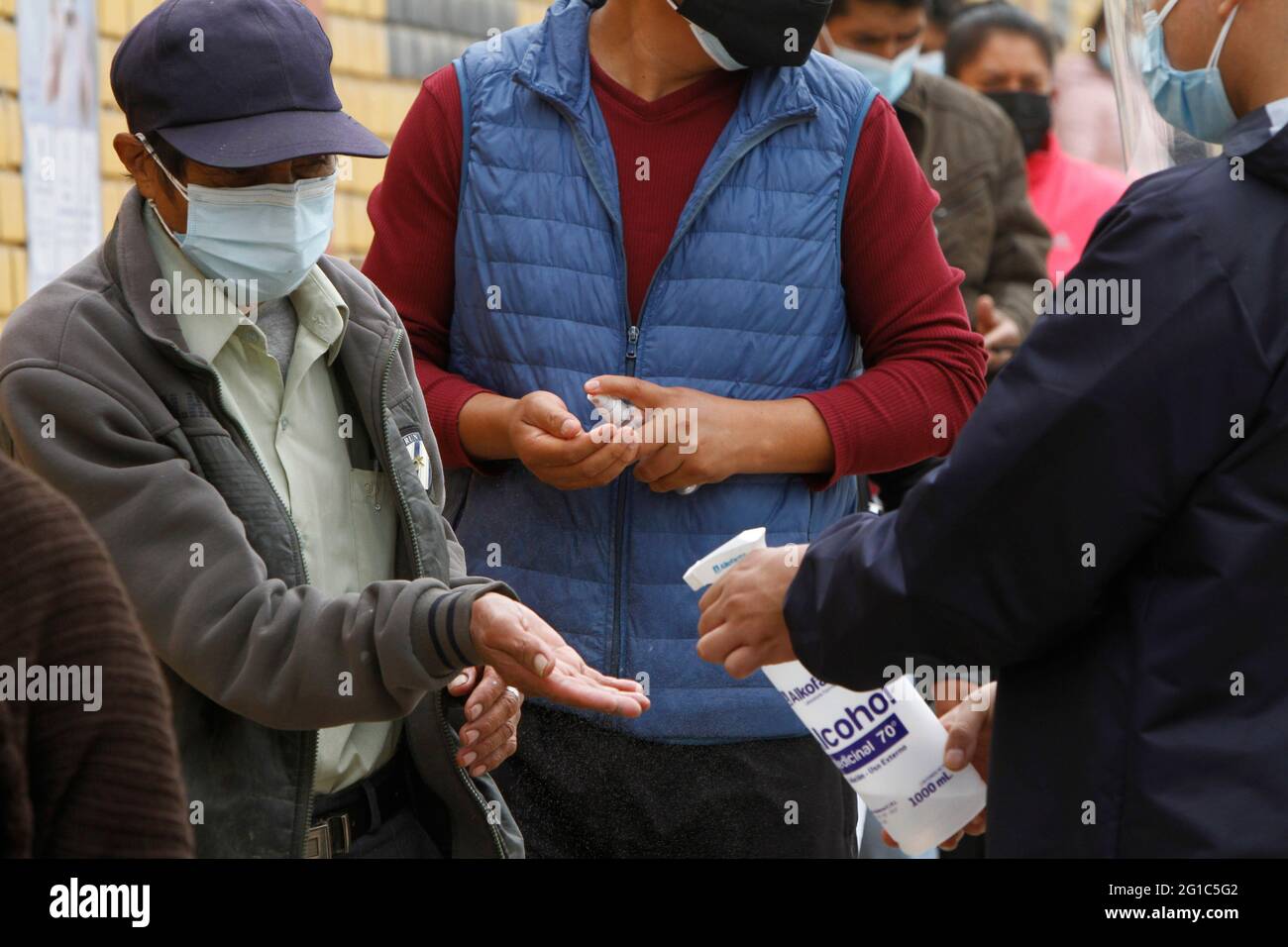 Lima. Peru. 6th June 2021. Presidential Elections. People lining up to cast their vote outside a public school where the voting took place. The school is located in the district of 'Manchay', one of the poorest communities on the outskirts of Lima. Stock Photo