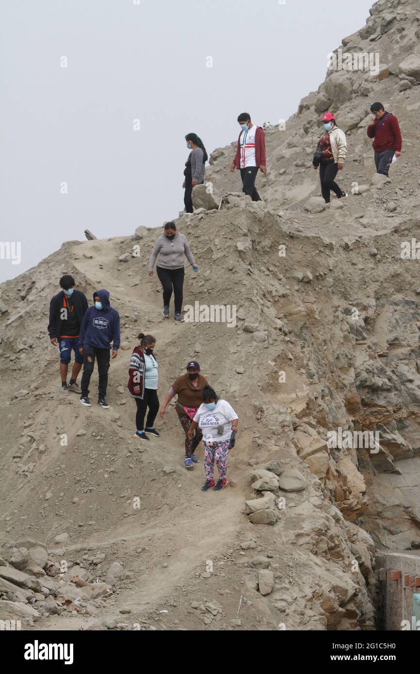 Lima. Peru. 6th June 2021. Presidential Elections. People going to cast their vote outside a public school where the voting took place. The school is located in the district of 'Manchay', one of the poorest communities on the outskirts of Lima. Stock Photo