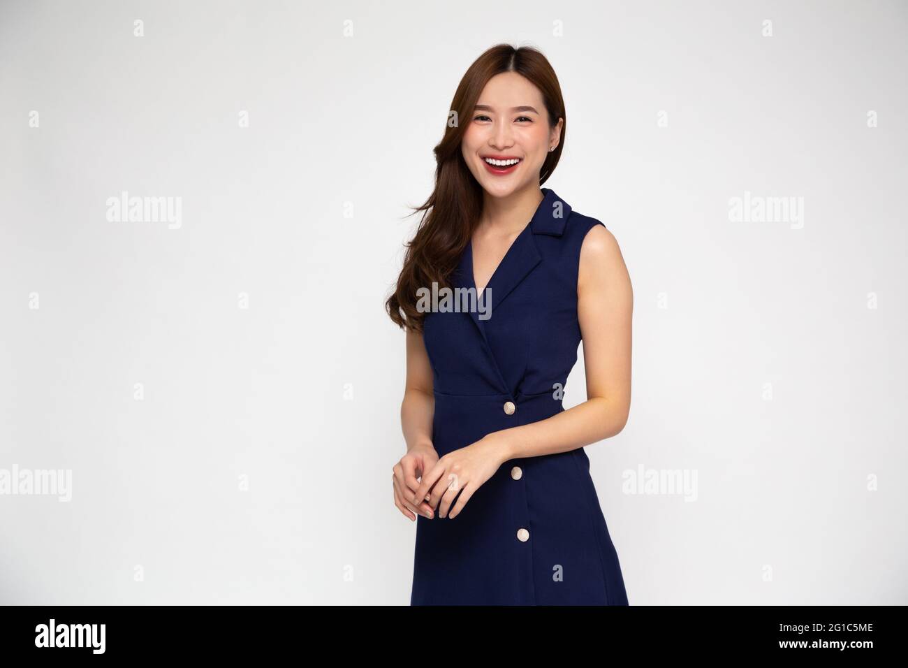 Portrait of Young beautiful Asian businesswoman standing and smiling ...