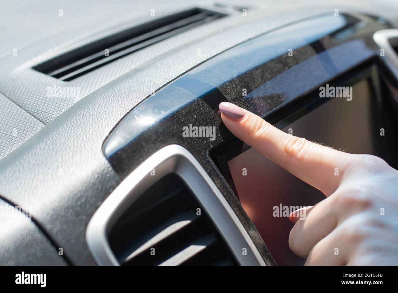Wipe dust off car dashboard with finger Stock Photo Alamy